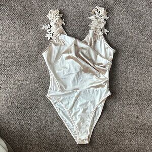 Elegant Cream Bodysuit with Floral Straps